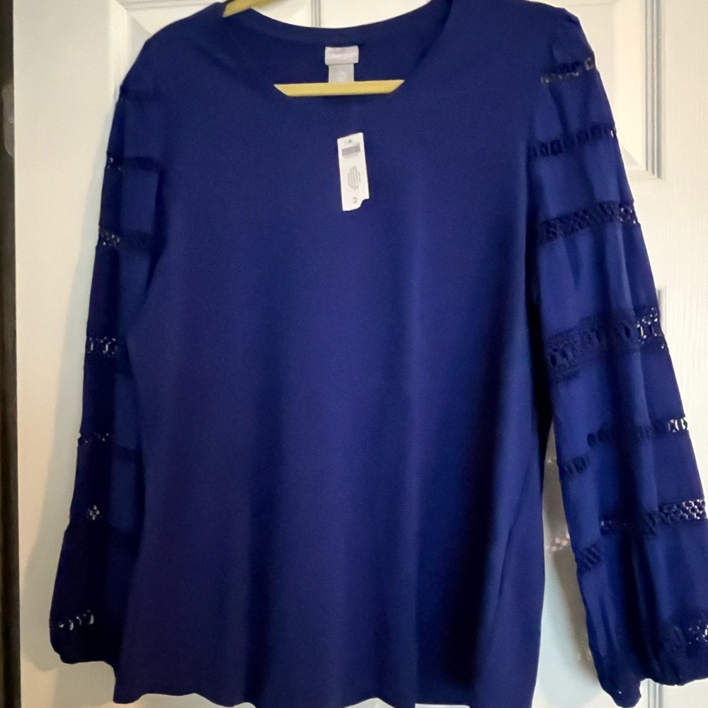 Blue knit top. Lace inset on sleeves
